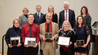 DELTA Awards for Excellence winners with Senior Management team. Top row left to right: Kay Zimmerman, Tim Petty, Donna Petherbridge, Tom Miller, Jessie Sova. Bottom row left to right: Alexis Simison, Jonathan Champ, Lou Harrison, Cathi Dunnagan, Bethanne Tobey.