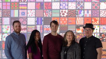 Members of the project team. From left to right: Dan Spencer, Jessica White, David Tredwell, Traci Lamar, Chris Willis. In front of TADA home screen projection.