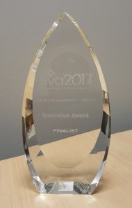 A pointed glass trophy reading EVA 2017. Innovation Award. NC State DELTA. Finalist.