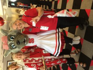 Dunnagan with mom Dot McGraw and NC State mascot Ms. Wuf at a football game against Marshall University. 