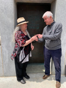 Dr. Tom Stafford presents Cathi Dunnagan with the key to the Memorial Belltower.