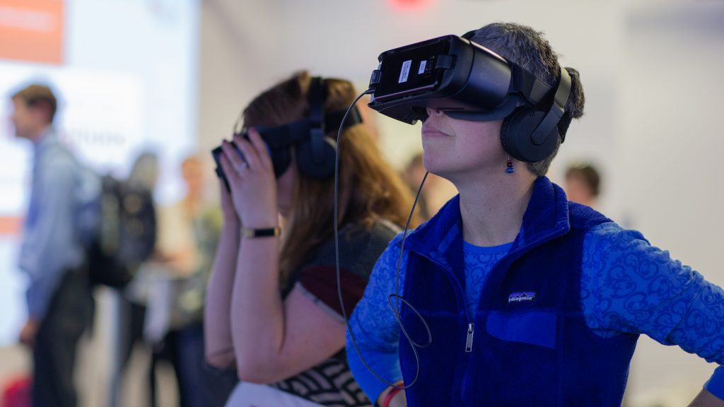 two faculty viewing VR experience